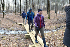 hikers on board walk in winter at River Road